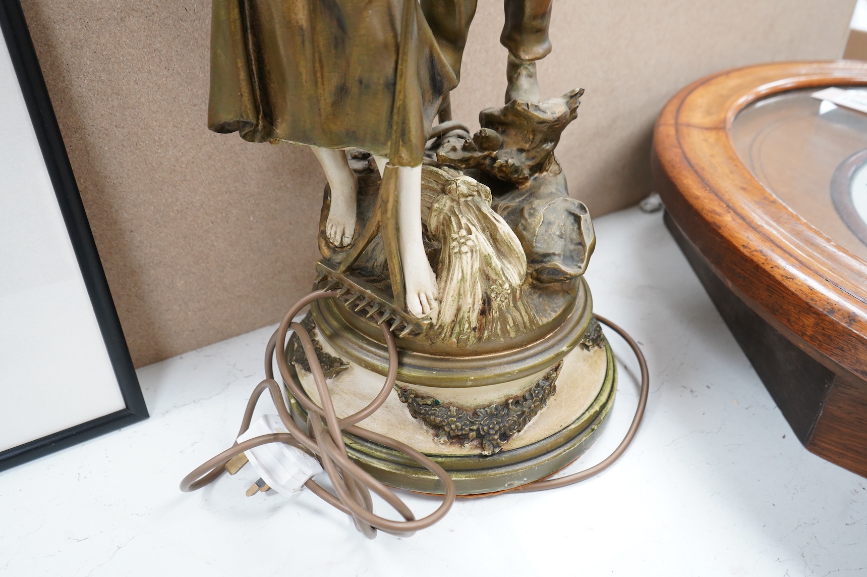 A figural spelter lamp with shade, 90cm high